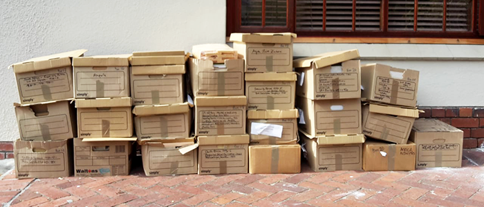 David Coetzee Collection of 23 boxes outside against wall