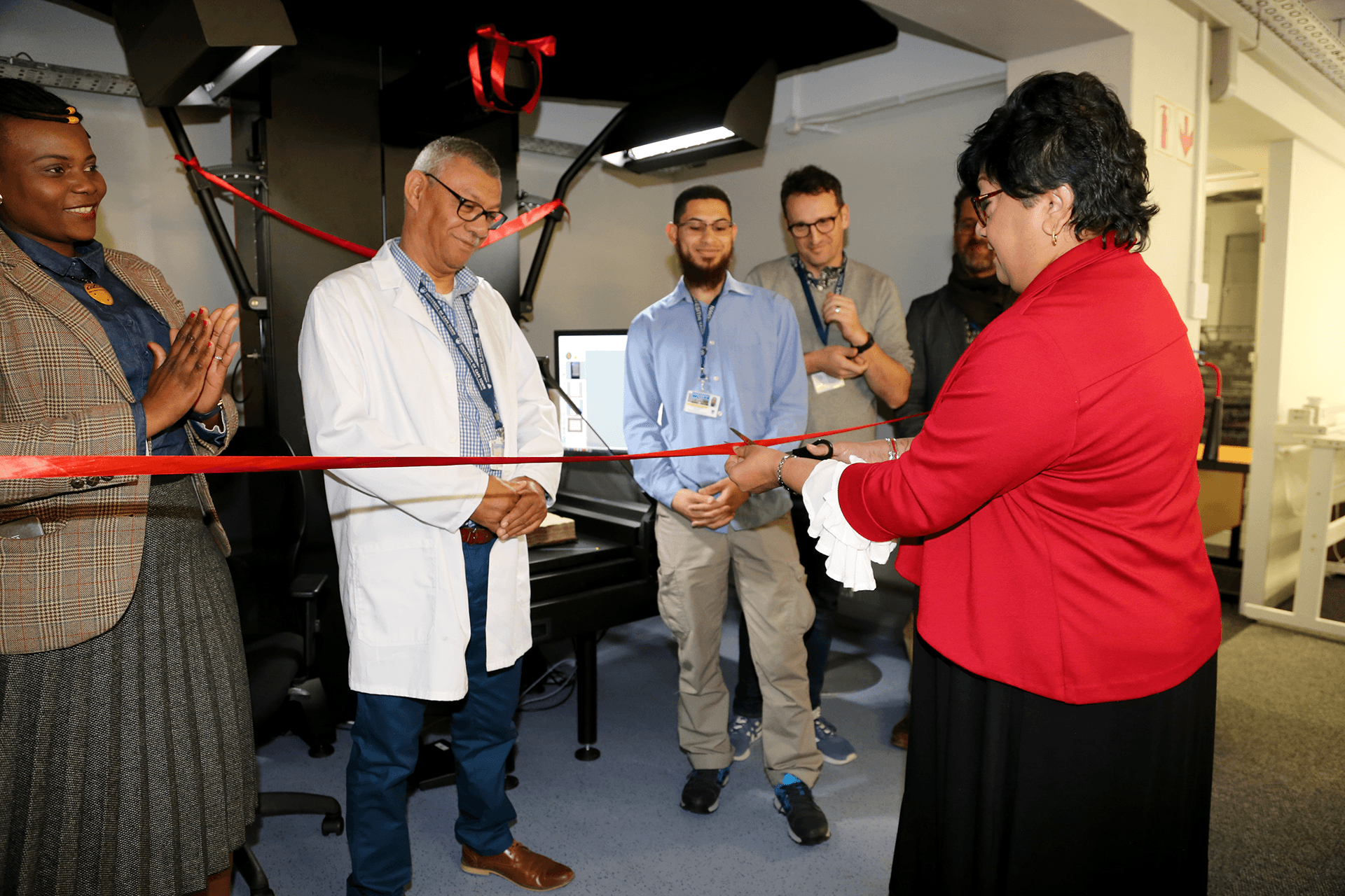 Libraries ED, Ujala Satgoor cuts the ribbon at the launch of the Zeutschel ScanStudio