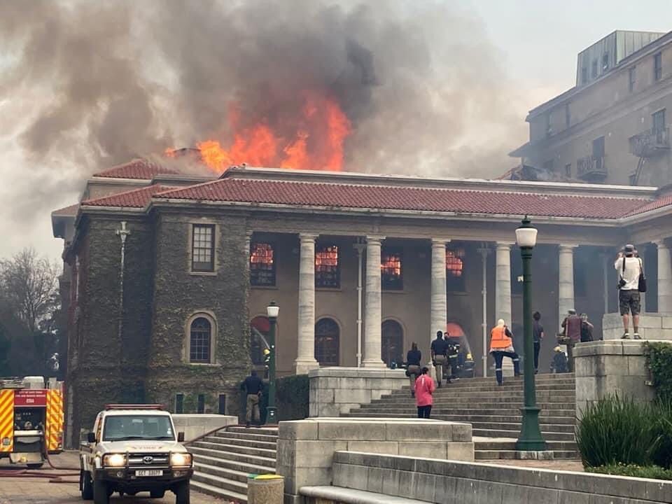 View of Jagger Library on fire with onlookers on Jammie steps