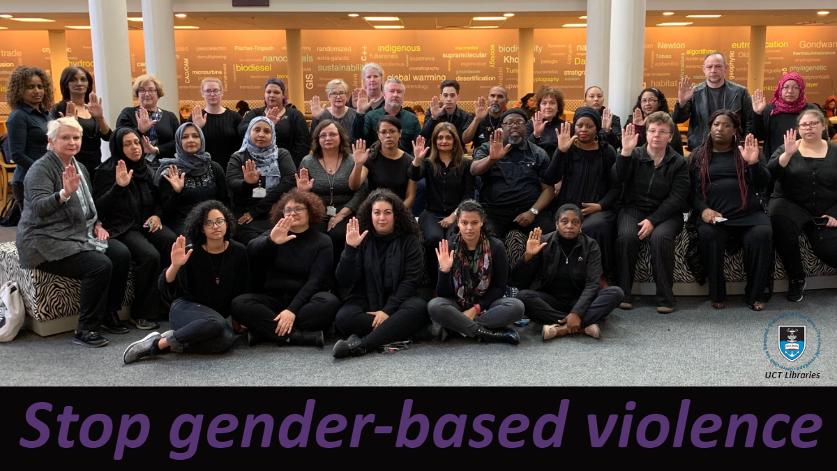 UCT Libraries staff seated and dressed in black in the Hub