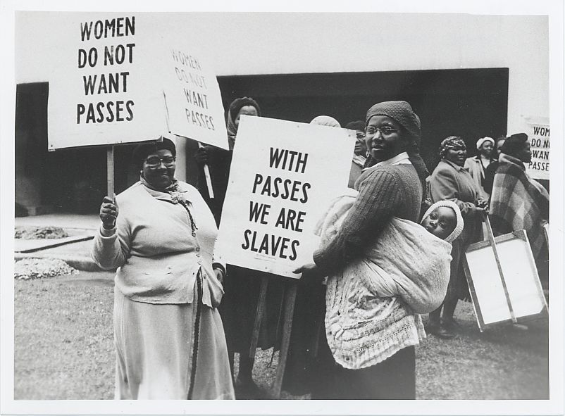 A group of women hold signs in demonstration against the pass laws in Cape Town on August 9, 1956.