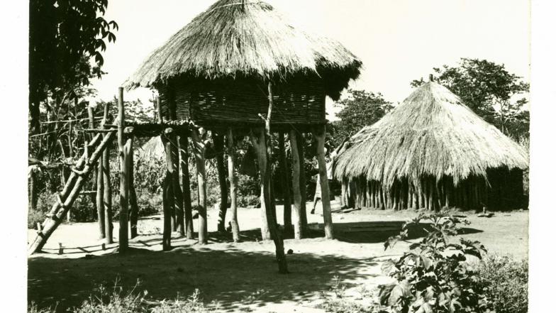 old photo of a group of straw huts