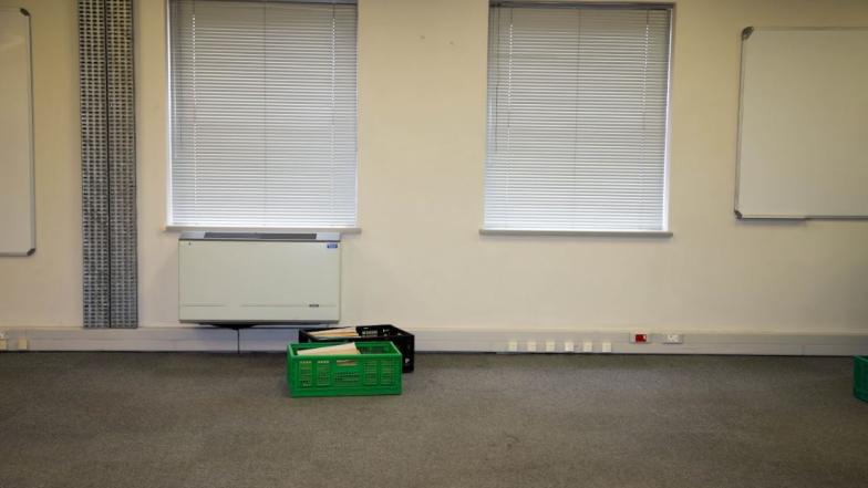 Two crates of African Studies Collection on floor in February 2023