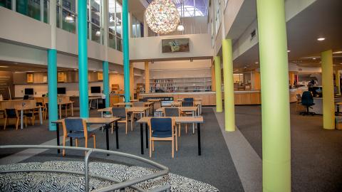 View of Hub from spiral staircase. Rows of single study seats facing the Loans Desk