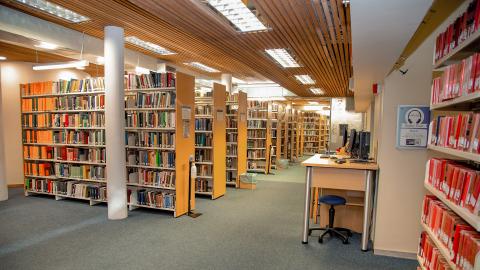 Rows of bookstacks lined with books