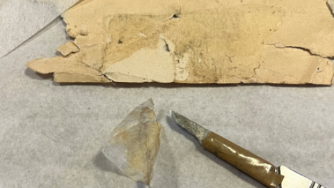 Manually removing the tape with hand tools