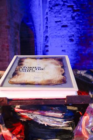Stories from the Ashes book resting on sculpted steel podium inside Jagger Reading Room