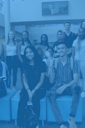 group photo of seated first year students inside library