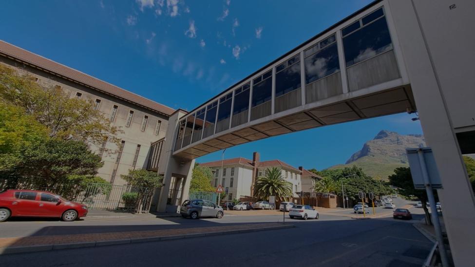 View of Health Sciences Library from Anzio road with bridge overhead