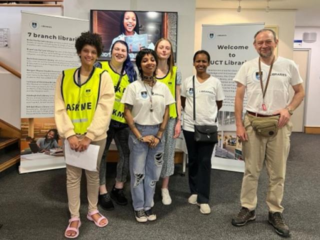 UCT Libraries Library Buddies and staff members pose in the Chancellor Oppenheimer foyer. Back from left: Mikayla Reid, Michaela de Waal and Awot Gebregziabher, and front from left, Tara de Wet, Auliya Badrudeen and Alex D'Angelo