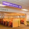 View of Hlanganani study area. Partitioned study desks with green and orange seats