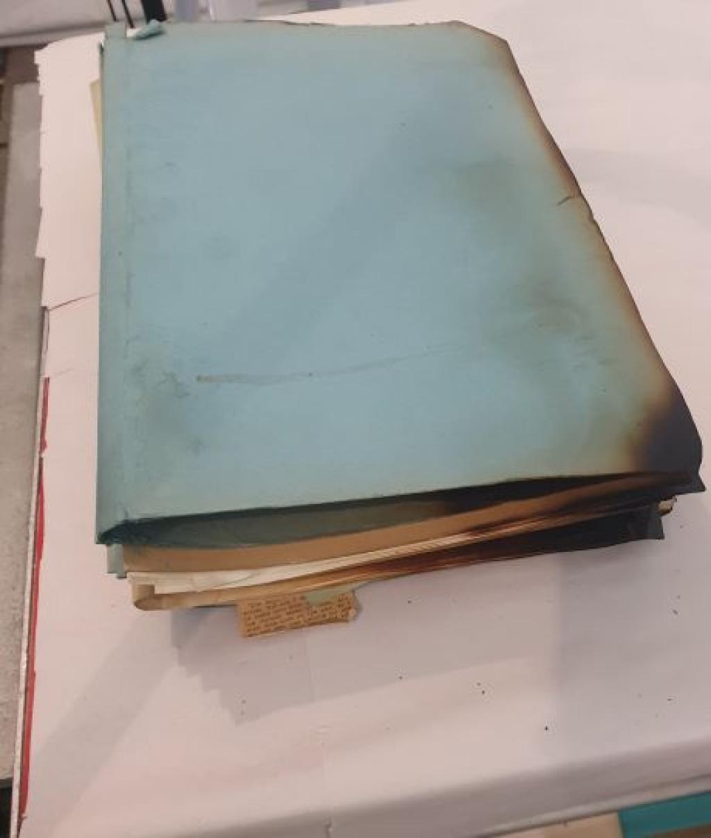 Lightly charred blue folder